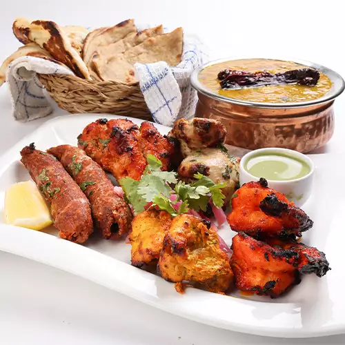 Tandoori Mixte : Une Symphonie de Saveurs Épicées